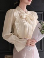 ⁦بلوزة نسائية بياقة ربطة وأكمام منتفخة⁩ - الصورة ⁦7⁩